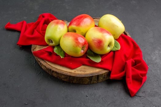 front-view-fresh-apples-ripe-fruits-red-tissue-grey-table-fresh-ripe-fruit-tree front-view-fresh-apples-ripe-fruits-red-tissue-grey-table-fresh-ripe-fruit-tree