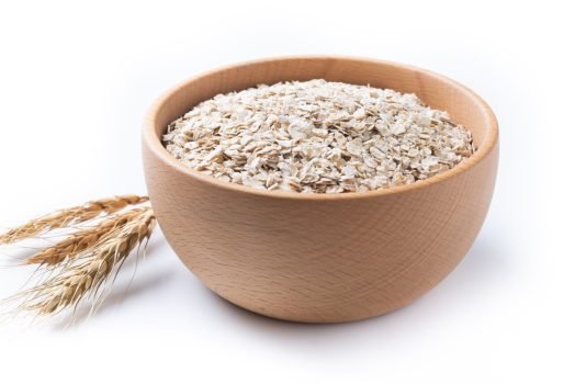 Rolled oats, healthy breakfast cereal oat flakes in bowl isolated on white background Rolled oats, healthy breakfast cereal oat flakes in bowl isolated on white background